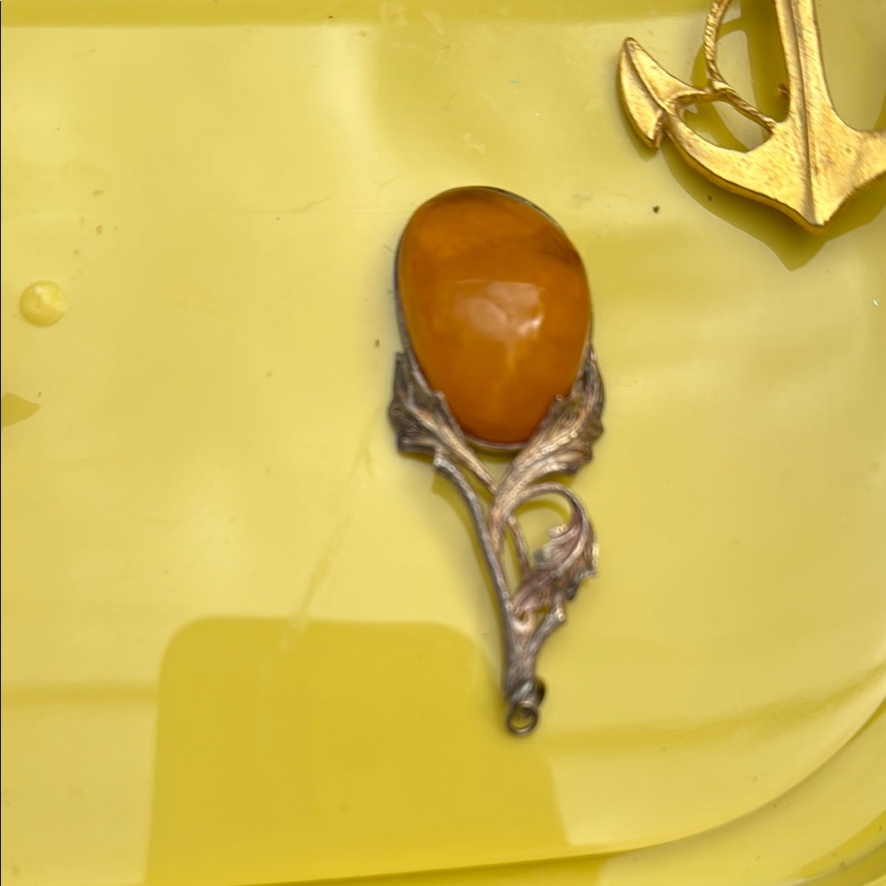 Elegant Amber Pendant with Silver Detailing